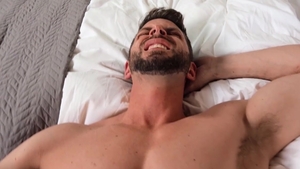 GodsOfMen - Tattooed athletic american gay gagging in the bed